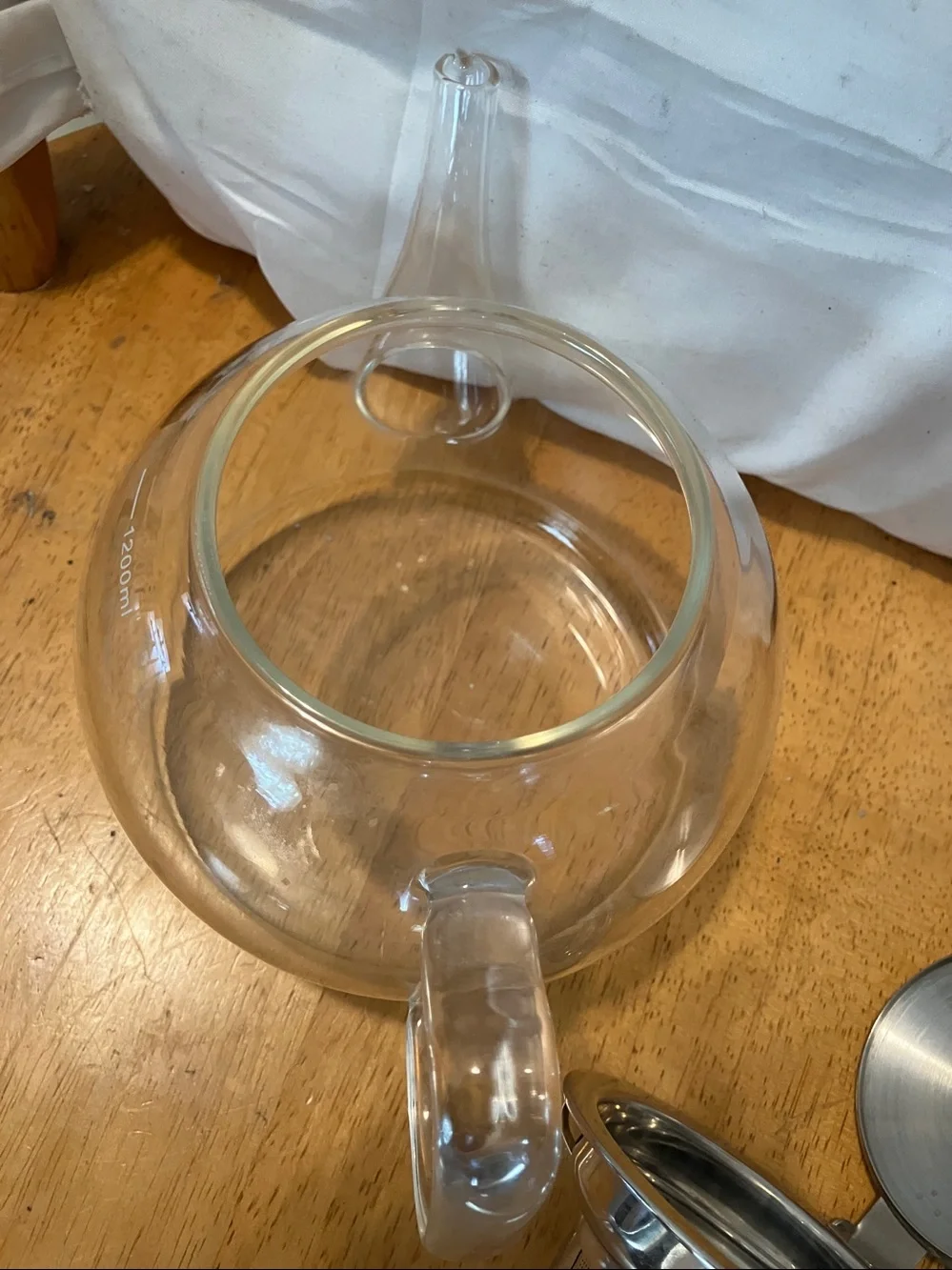 Like new. French press style glass tea pot with stainless steel pieces